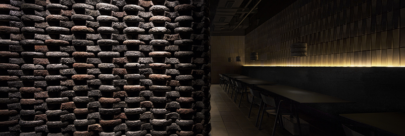 infinity nide brings the tradition of black chinese earthenware into restaurant interior