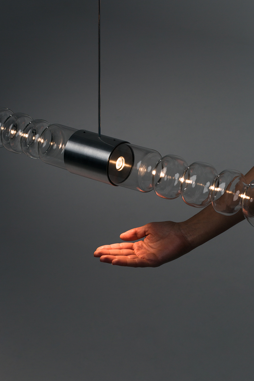 filamento, an over 1-meter long glass lighting sculpture designed by mayice designboom