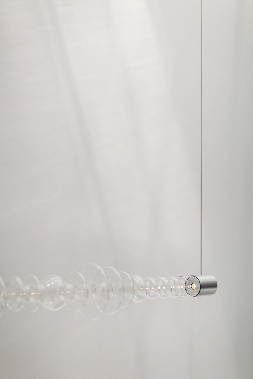 filamento, an over 1-meter long glass lighting sculpture designed by mayice designboom