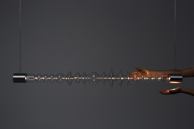 filamento, an over 1-meter long glass lighting sculpture designed by mayice designboom