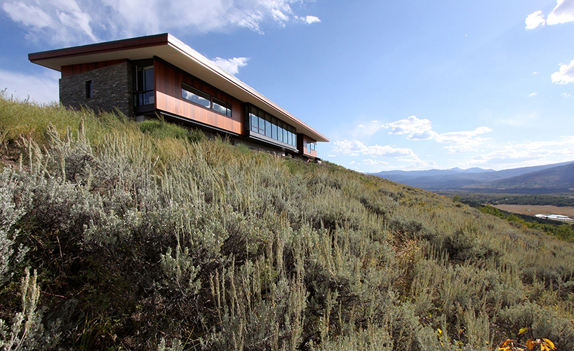 WELCH|HALL architects' cedar-covered home in wyoming overlooks the surrounding valleys
