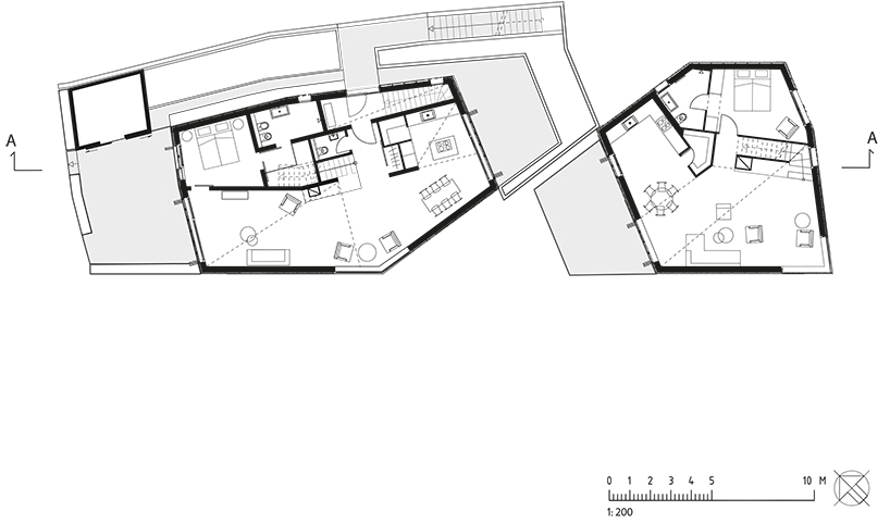 grotto-like, sibling residences elevate the rough expression of unfinished wood