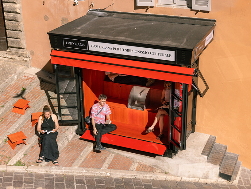 historic perugia newsstand reconfigures into stepped red oak mini reading kiosk - 1