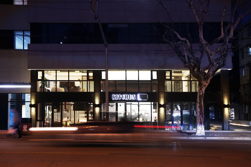 kitchen L by XU studio is a flexible shanghai restaurant decorated with copper kitchenware