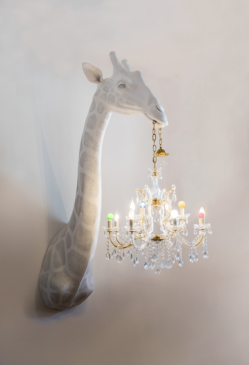 marcantonio's instinct illumination series depicts creatures holding ripped chandeliers