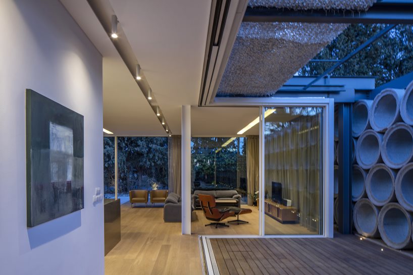glass sheets and concrete tubes envelope vardastudio's residence in cyprus