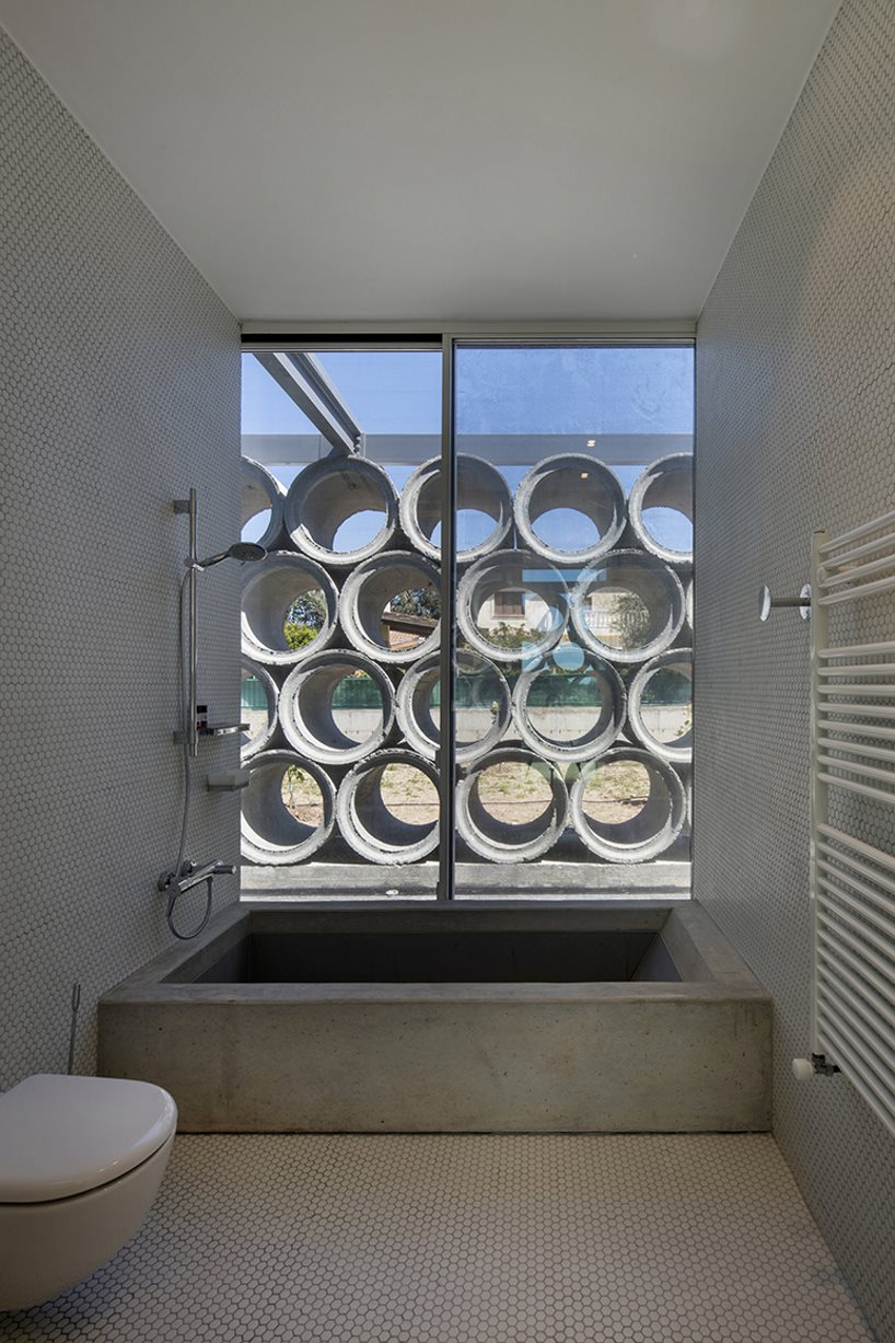 glass sheets and concrete tubes envelope vardastudio's residence in cyprus