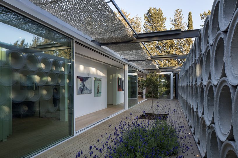 glass sheets and concrete tubes envelope vardastudio's residence in cyprus