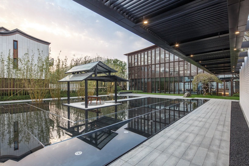 lacime architects reflects the suzhou leisure center in pools of water in china