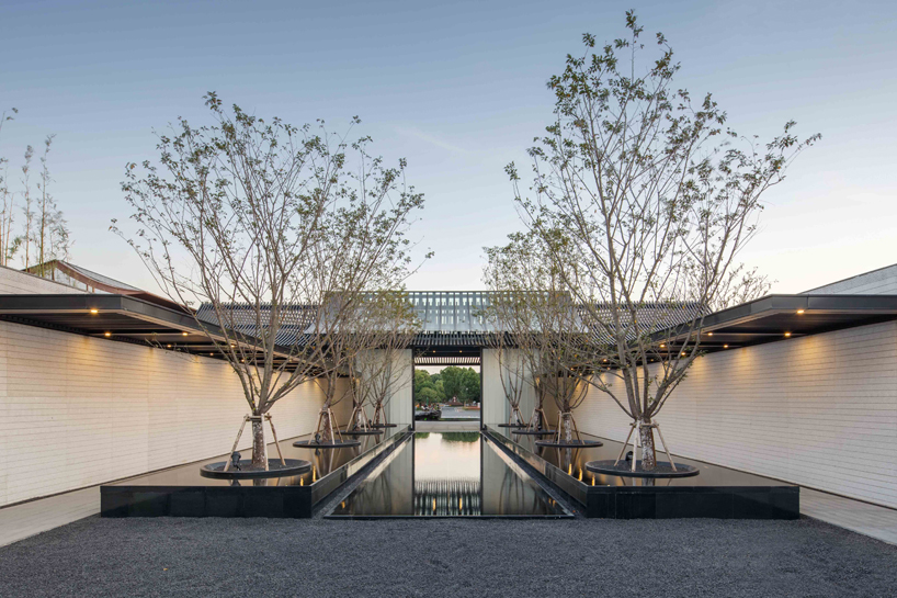 lacime architects reflects the suzhou leisure center in pools of water in china