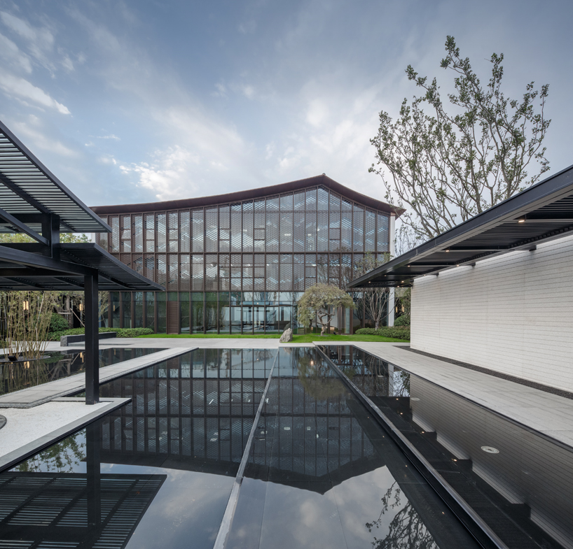 lacime architects reflects the suzhou leisure center in pools of water in china