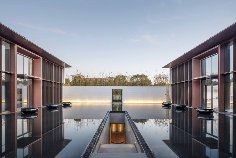 lacime architects reflects the suzhou leisure center in pools of water in china