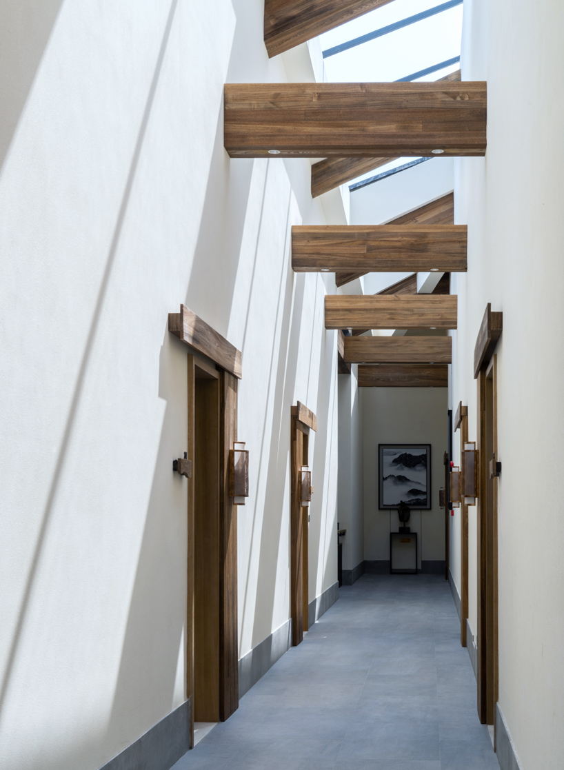 lacime architects integrates luxury resort into chinese mountain scenery