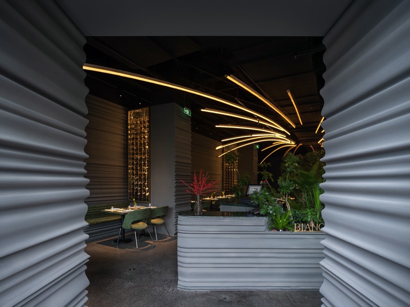 undulating walls emerge within WAY studio's restaurant in shanghai