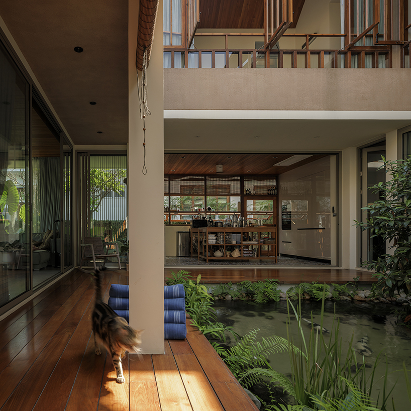 cedar shingle roof crowns tropical residence with green courtyard in thailand