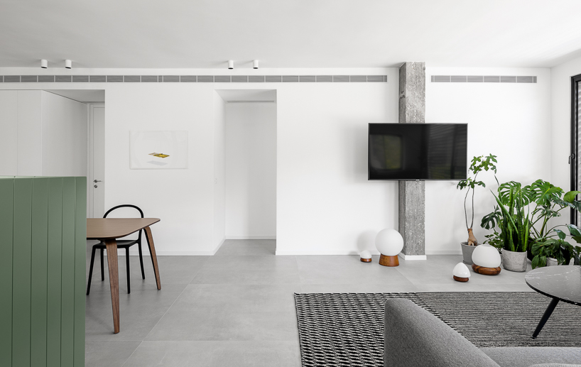 studioDO forms the BZ apartment as an olive-green weekend retreat in tel-aviv designboom