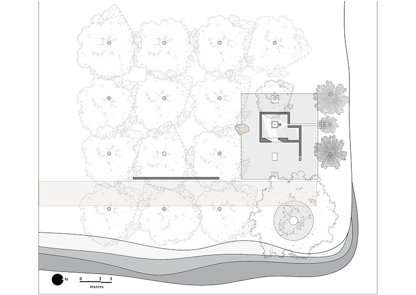 karan darda's orange hindu temple in india creates a contrast with green surroundings