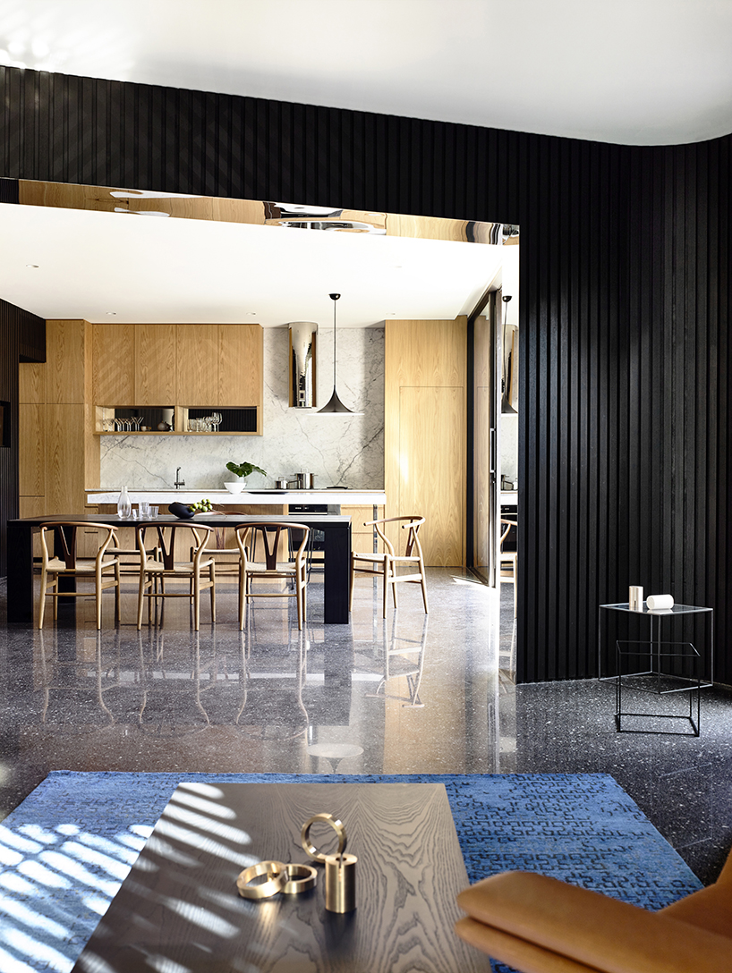 pandolfini architects adapts sculptural townhouse in australia to fit large family