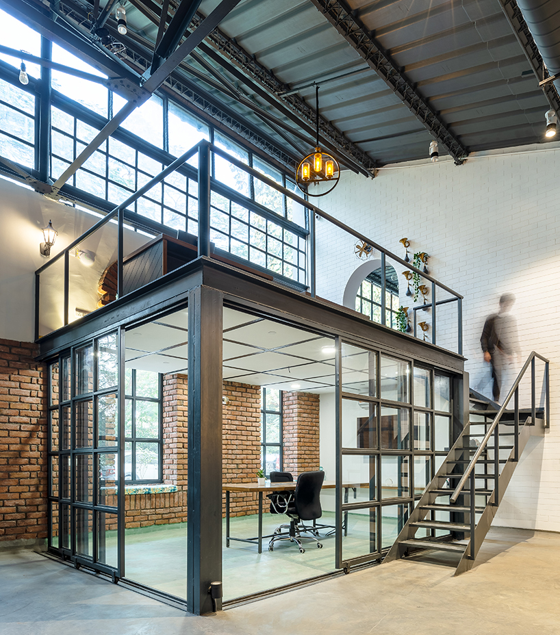 studio bipolar converts a 60s era warehouse in new dehli into an industrial dream office designboom