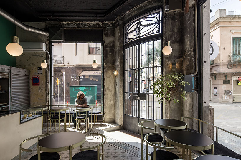 green walls and yellow zinc details decorate taller capitan's coffee shop in uruguay designboom