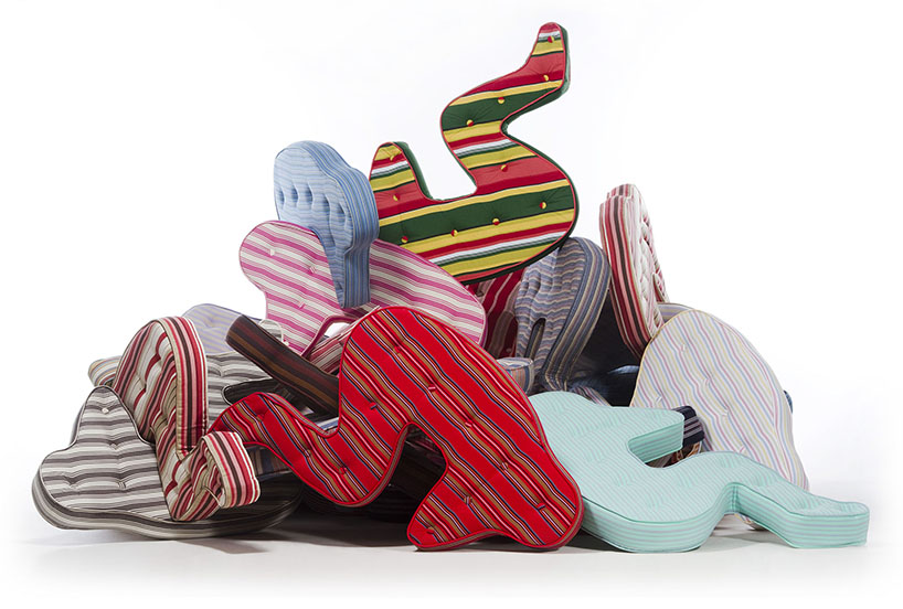 heleno bernardi scatters fetal-shaped mattresses in public spaces all over the world