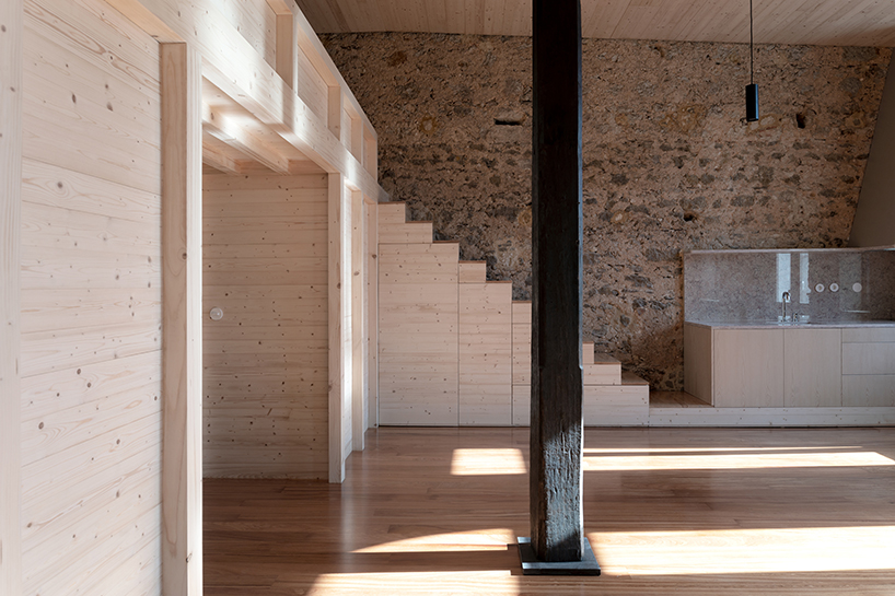 NPS arquitectos turns an early 20th-century building in portugal into a timber loft
