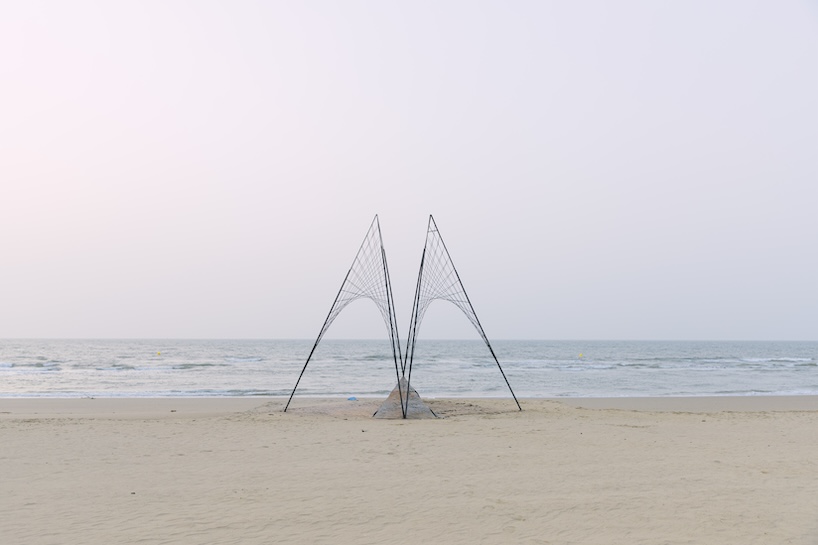 atelier heimat crafts burning perforated wooden installation for theater festival in china