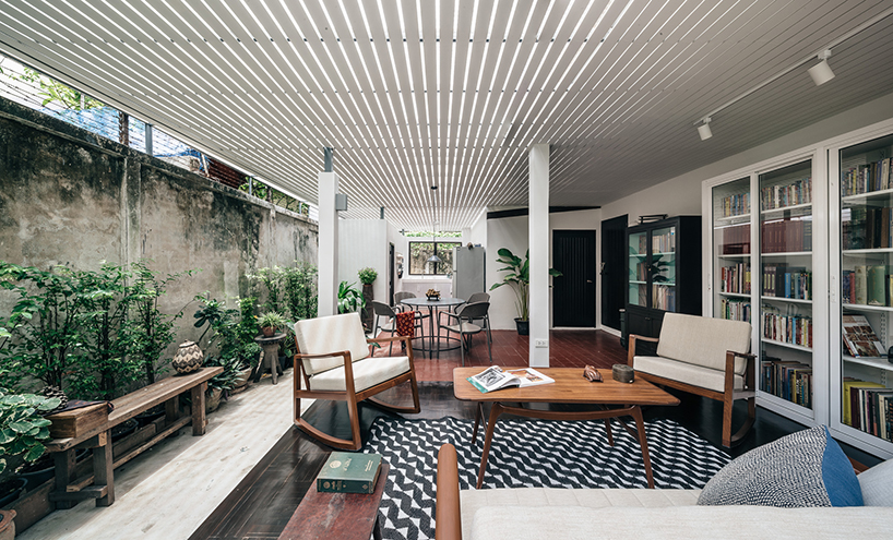 architect turns an old storage in thailand into a home library