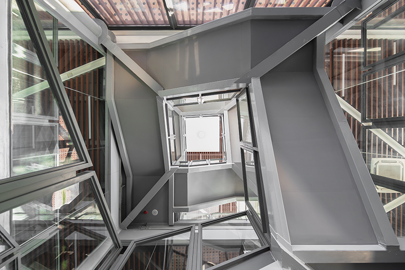 MLA+'s library in shenzhen park features an elevated walkway through the three crowns