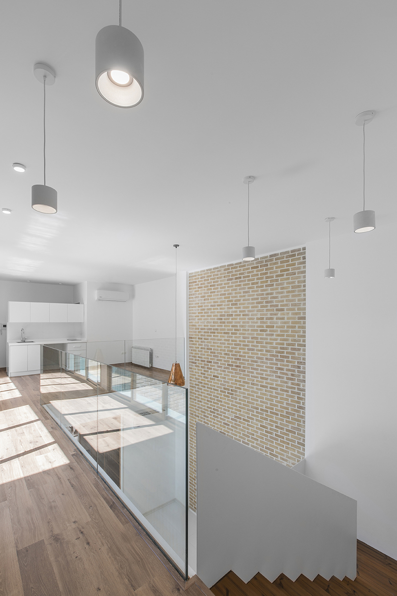 ayeneh office's house in iran takes shape around a central yard clad in blue tiles