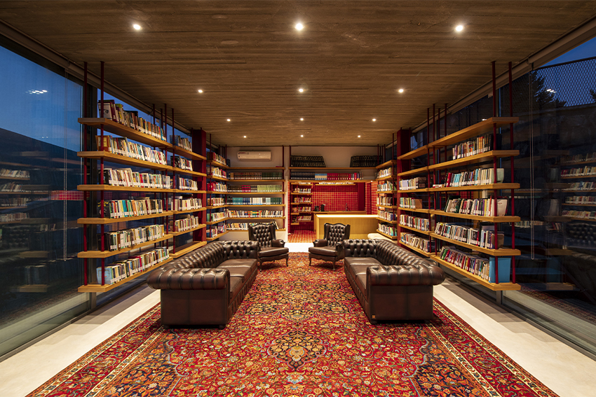 suspended bookshelves float within villa's glazed volume by ayeneh office in tehran
