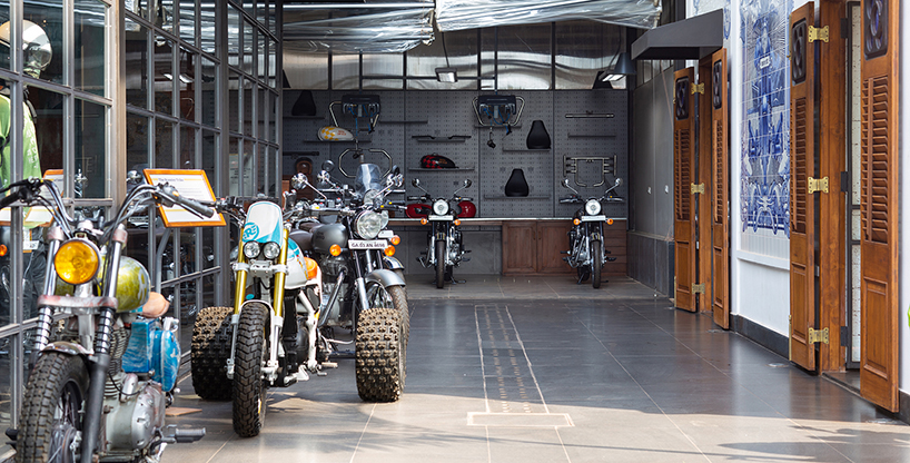 industrial style royal enfield garage cafe in goa is covered with portuguese hand-painted tiles, by studio lotus