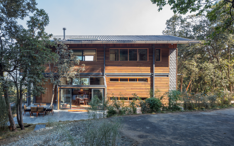 timber villa in the woods by studio lotus floats among himalayan forest