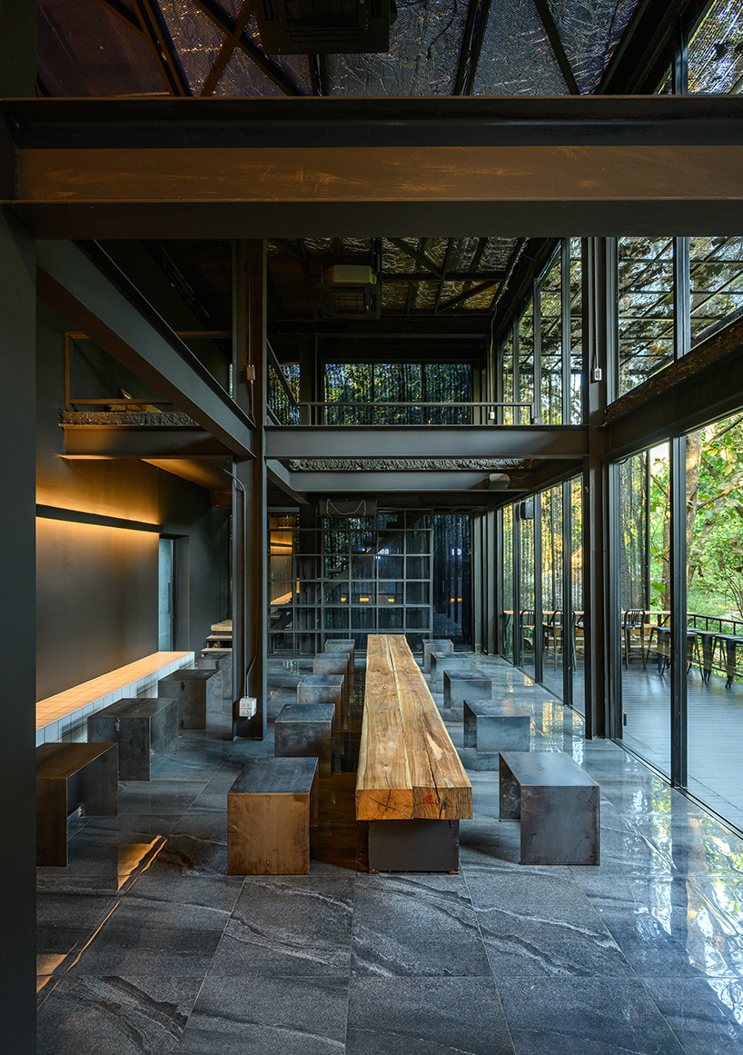 sher maker covers cafe in thailand in opaque, plastic curtains and mirrors
