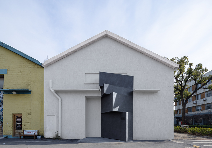 far workshop converts industrial warehouse into an art gallery in shanghai