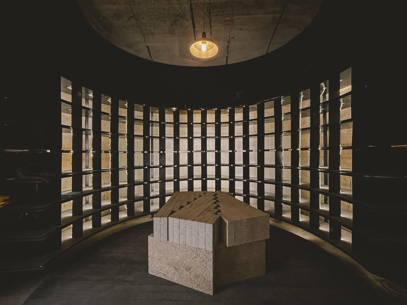 far workshop revives chinese lodge as wine cellar marked by black concrete columns