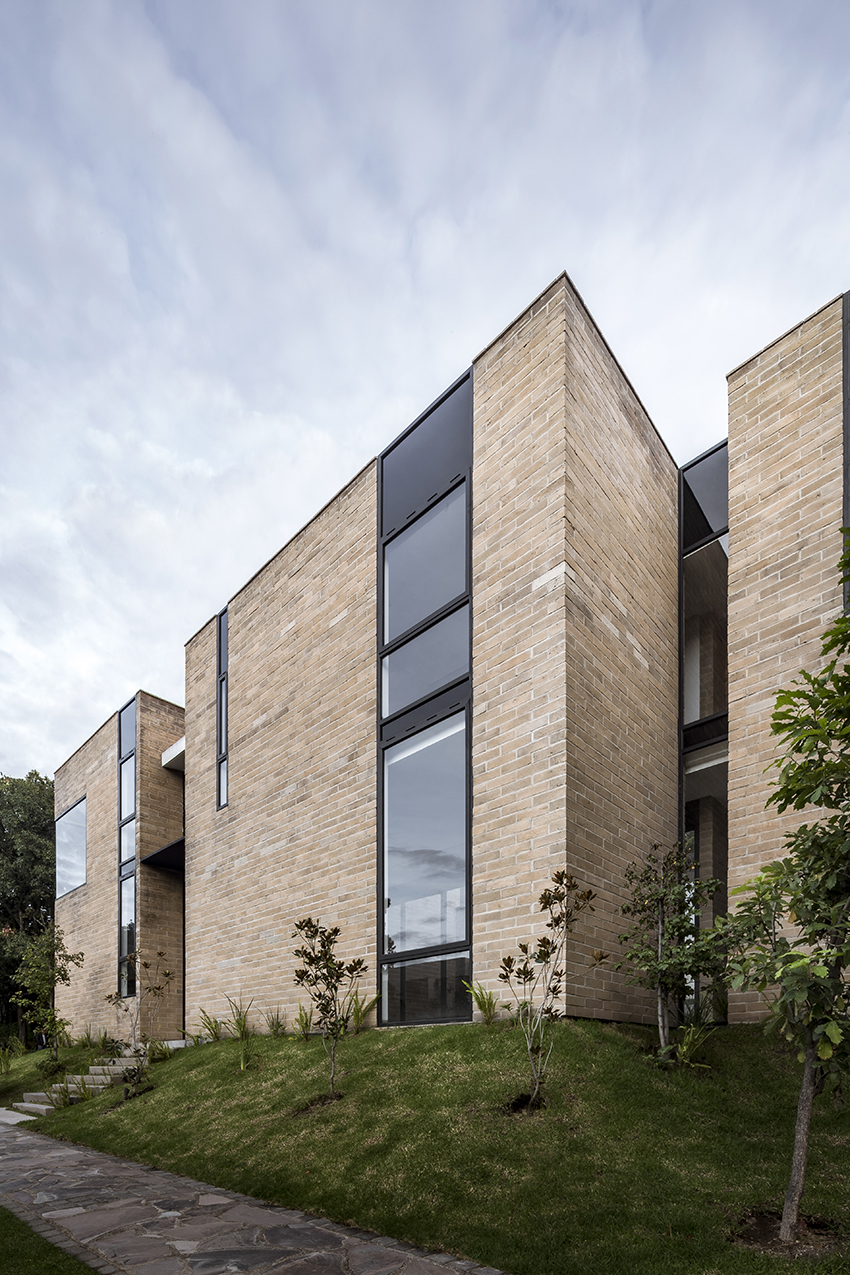 andres burguete creates 'house el cielo' from three brick volumes in mexico