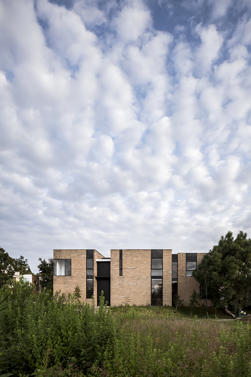 andres burguete creates 'house el cielo' from three brick volumes in mexico