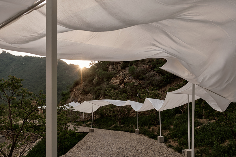 whispers of wind and steel the fans ethereal dialogue with jinshanlings ancient landscape 6