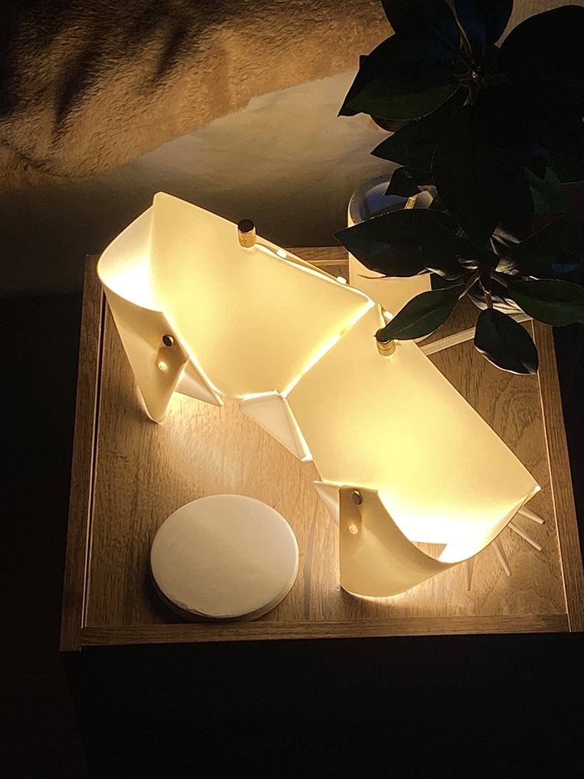 origami crab lamp folds into a softly glowing nightstand companion