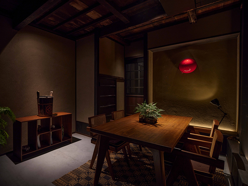 copper-plated facade enfolds renovated izutsuya gallery in tokyo