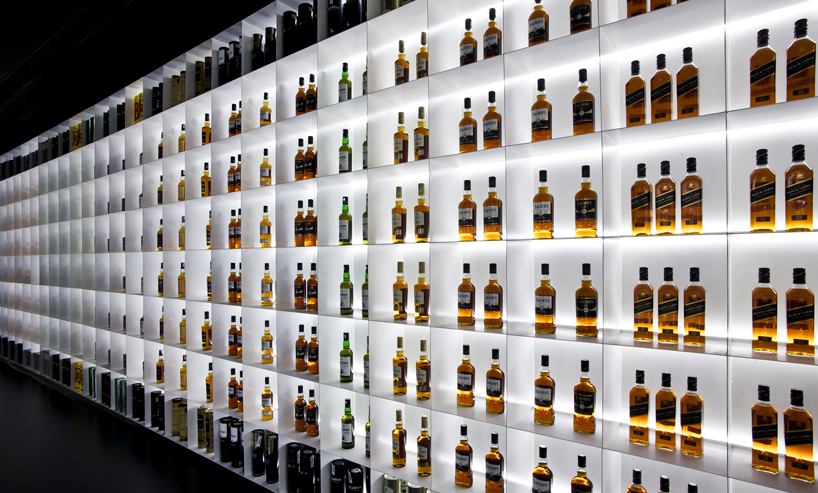 iksoi design studio creates monochromatic interior for liquor store in india