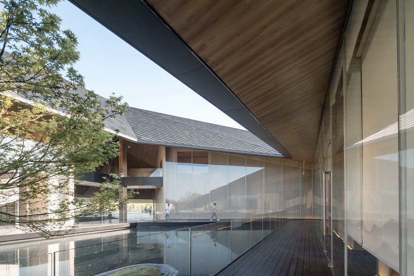 XAA's lakeside academy appears to float on water in meishan city, china designboom