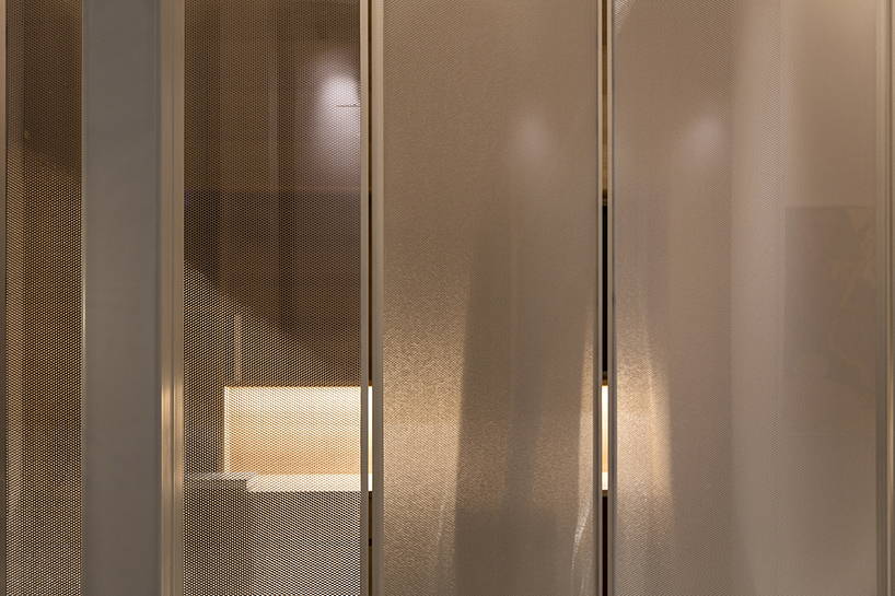 sliding dividers easily turn this tel aviv apartment into an open space