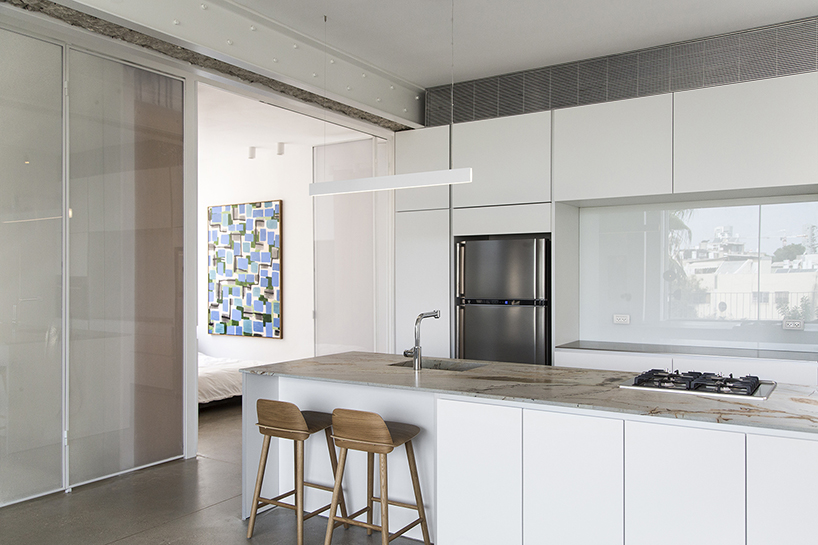sliding dividers easily turn this tel aviv apartment into an open space milic harel designboom