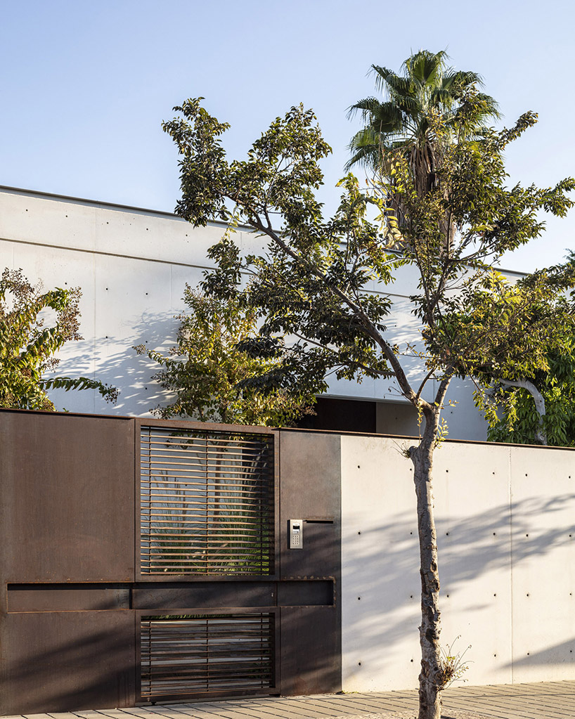 off white concrete facade creates maximum privacy for this tel aviv house 1