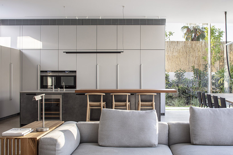 off white concrete facade creates maximum privacy for this tel aviv house 9