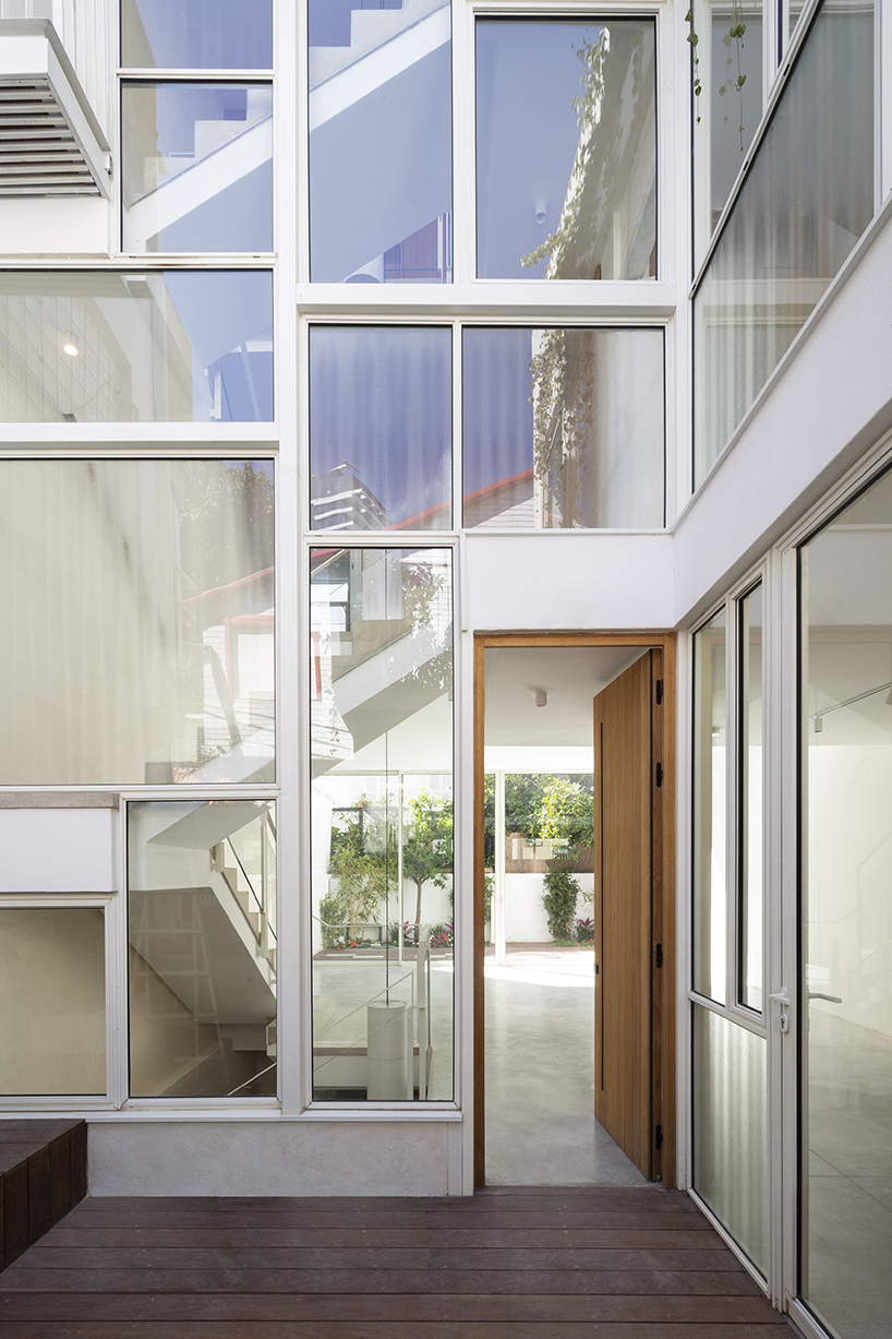 D house shapes multiple clever facades in tel aviv neighborhood