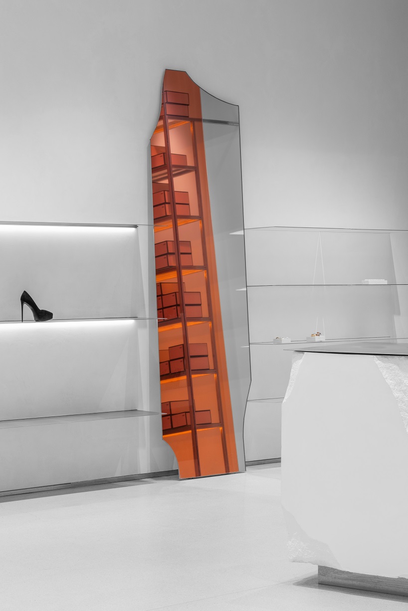 da bureau scatters white stone blocks into footwear concept store in moscow