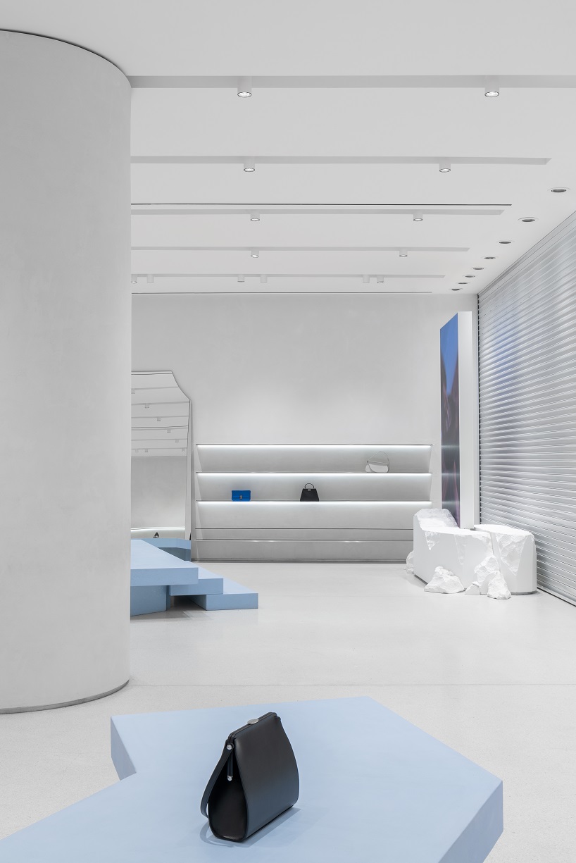 da bureau scatters white stone blocks into footwear concept store in moscow